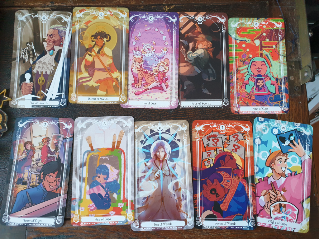 ten more turnabout tarot cards. notably, the five of swords is von karma being terrifying, the seven of wands is dhurke, and the knight of cups is larry.