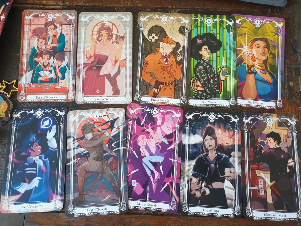 ten turnabout tarot cards. of note, the court cards for swords are all tgaa characters: naruhodo, herlock, susato and asogi respectively. uendo toneido is the eight of pentacles.